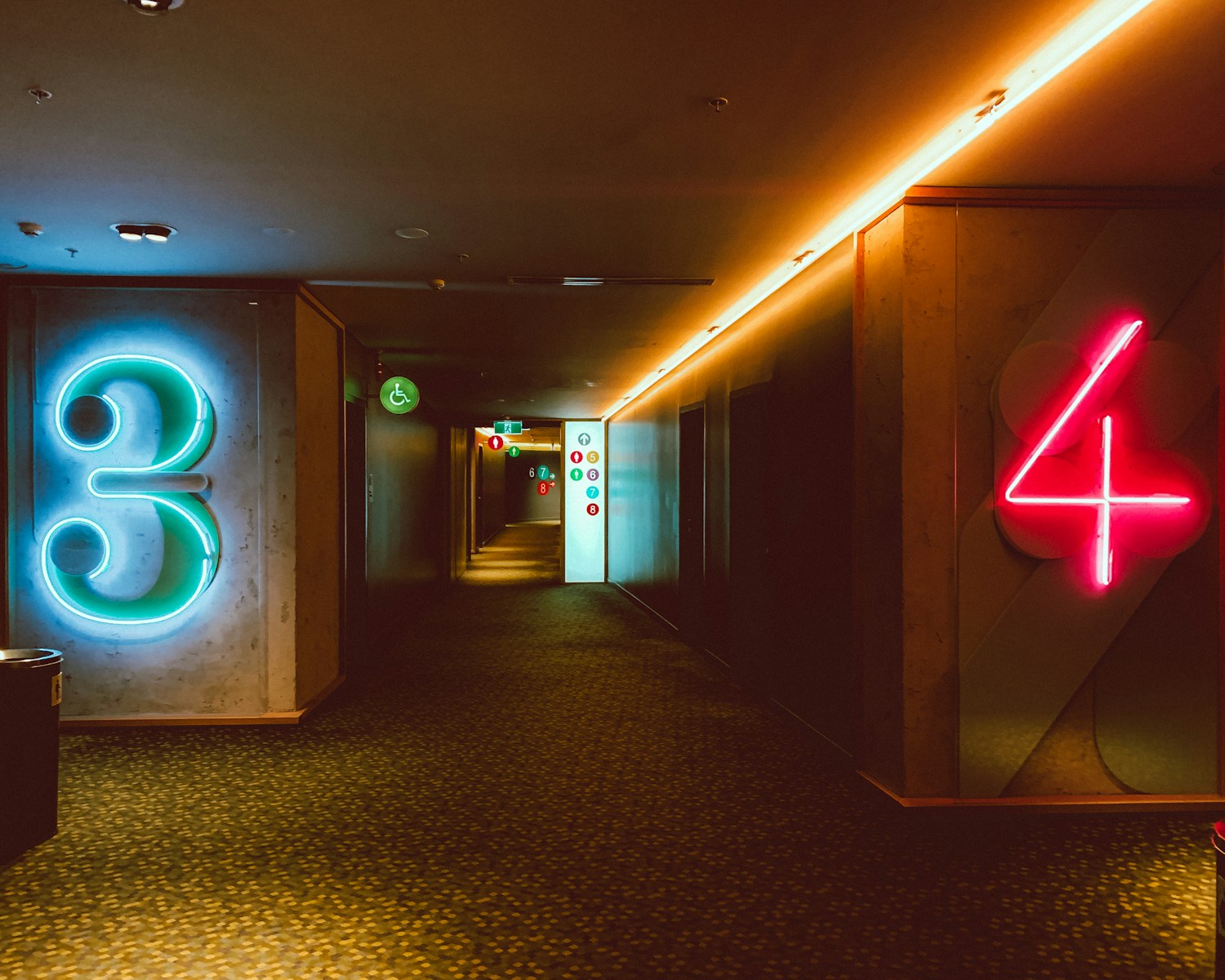 hallway with lights turned on in a room