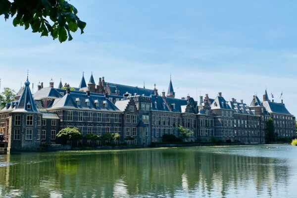 a large building sitting next to a body of water