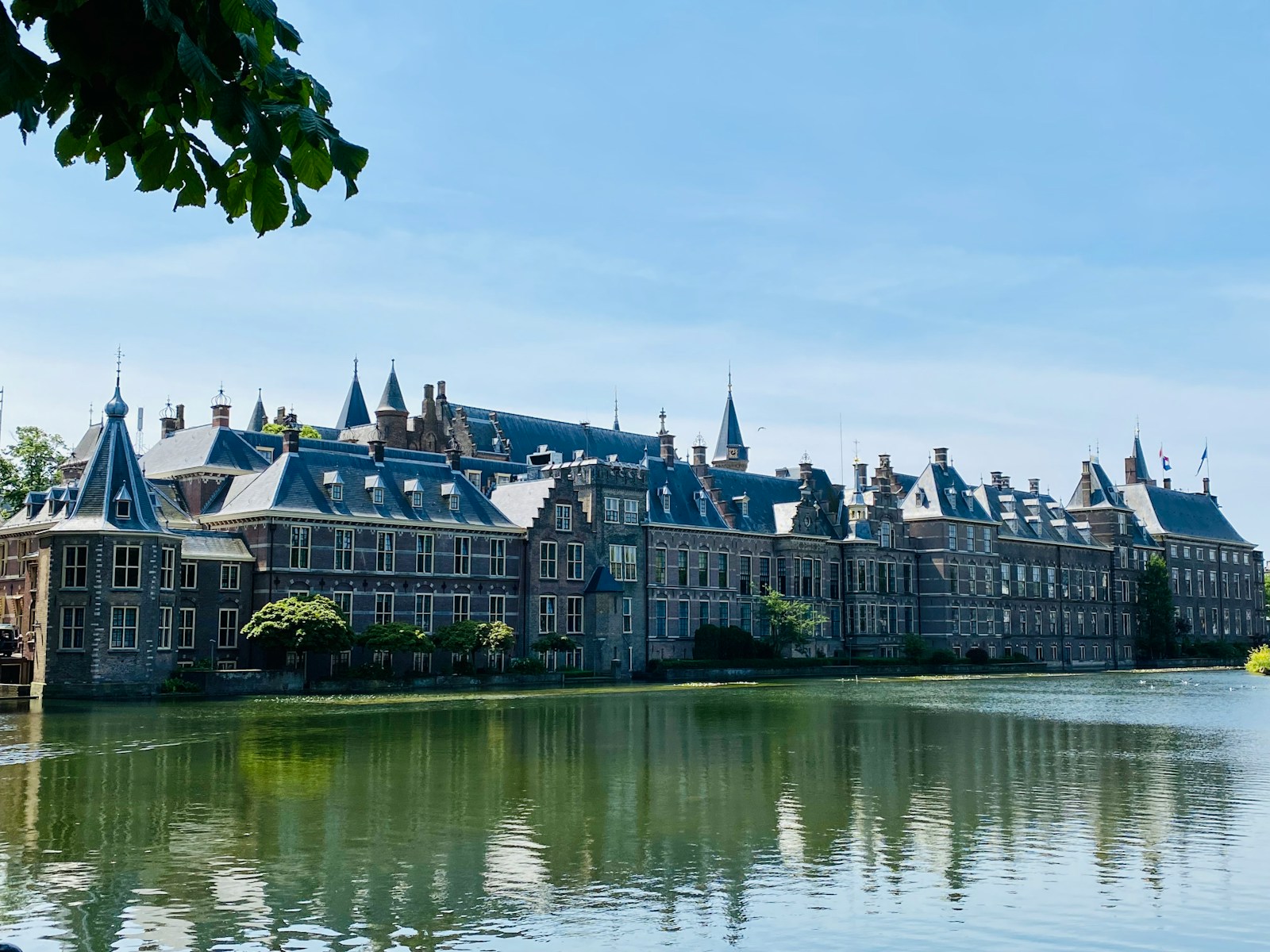 a large building sitting next to a body of water