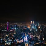 city with high rise buildings during night time