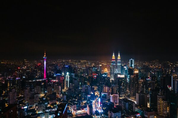 city with high rise buildings during night time