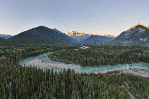 an aerial view of a river and mountains