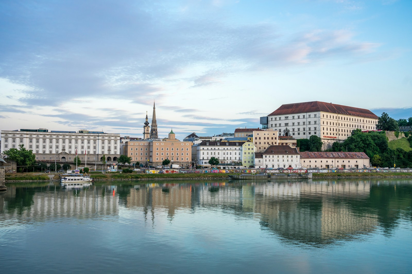 a body of water with buildings in the background