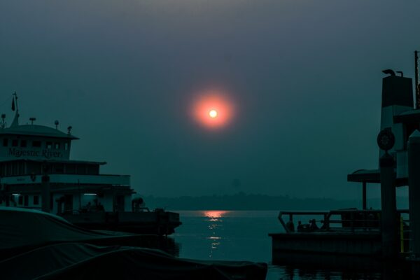 The sun is setting over a body of water