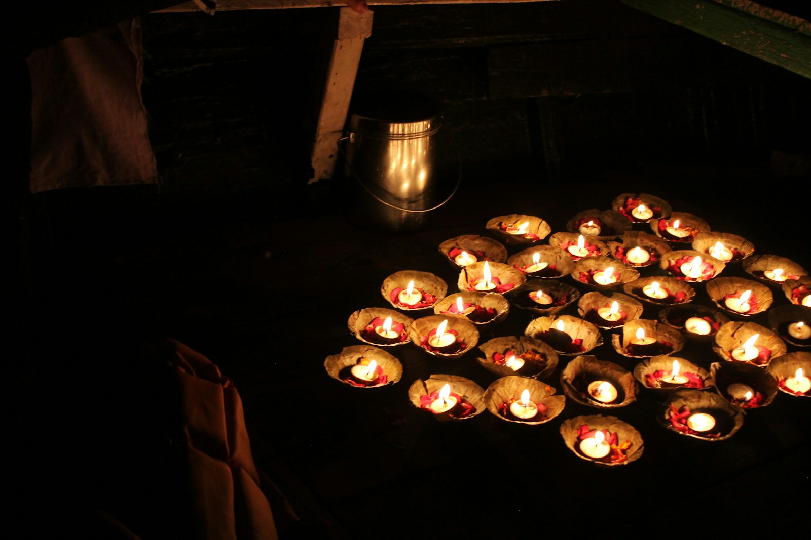 a bunch of lit candles sitting on top of a table