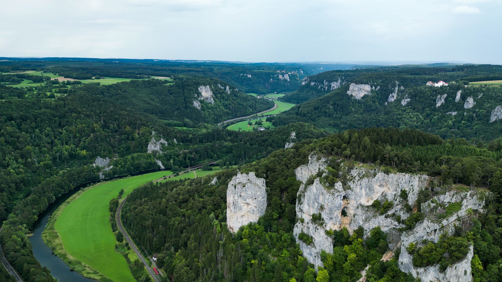 a river running through a lush green valley