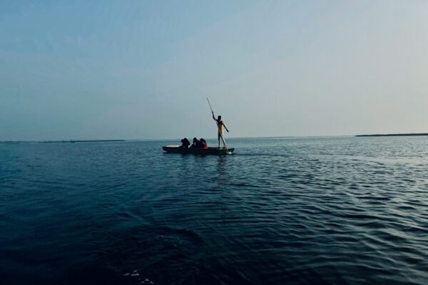 2 person riding on boat on sea during daytime