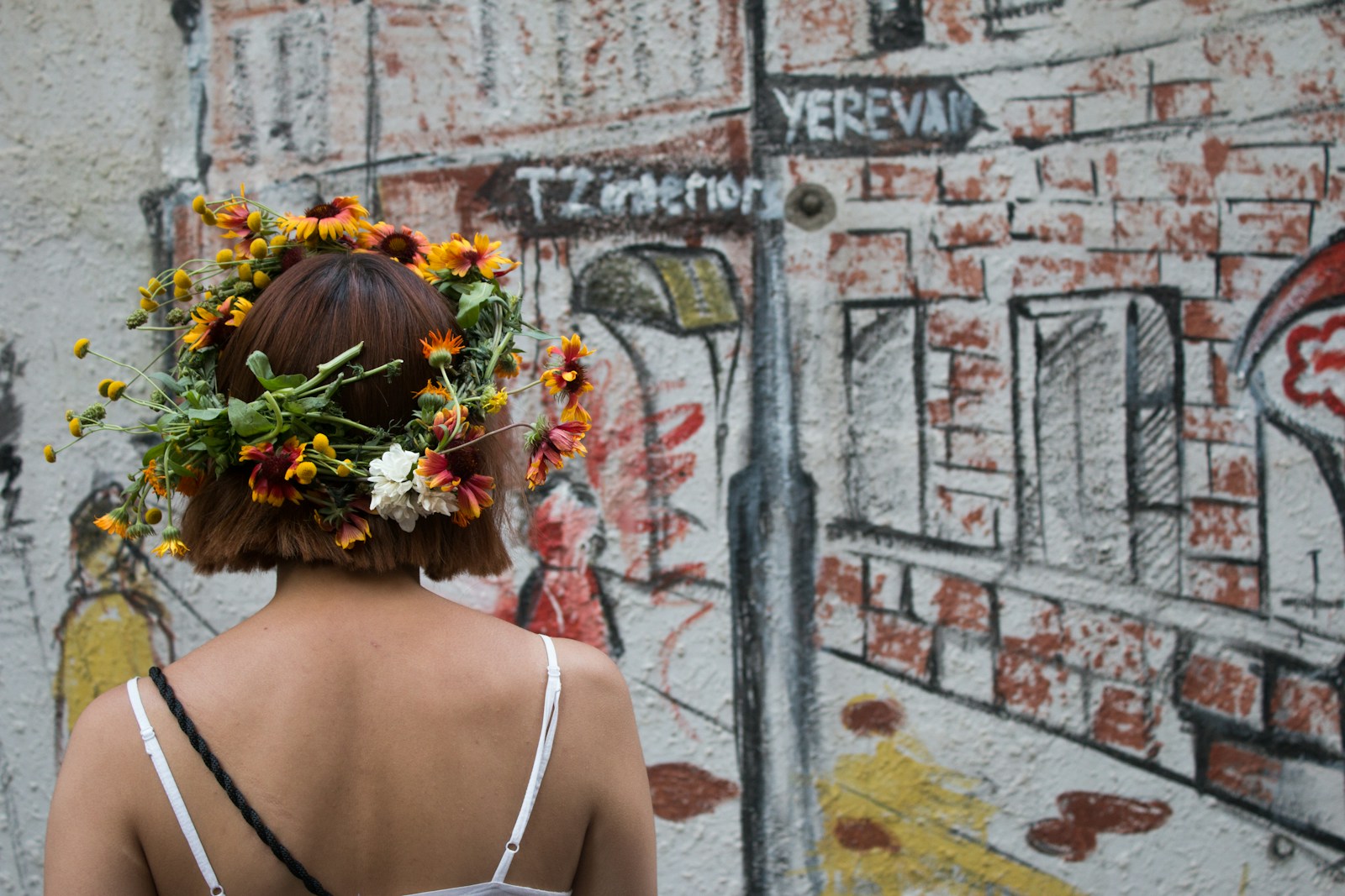 a woman with a flower crown on her head