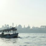 people riding on boat on sea during daytime