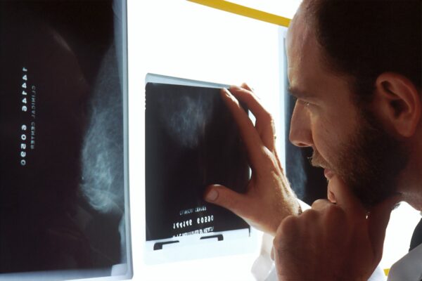 person holding black tablet computer