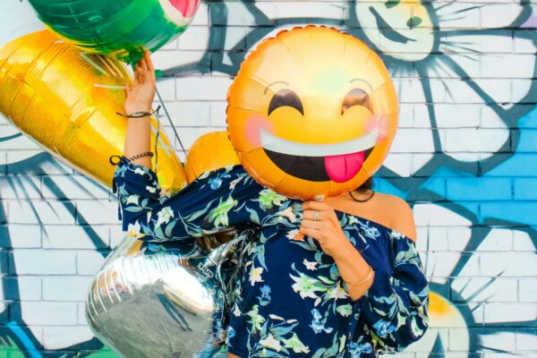 woman holding balloons