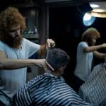 person having hair cut