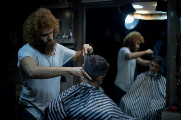 person having hair cut