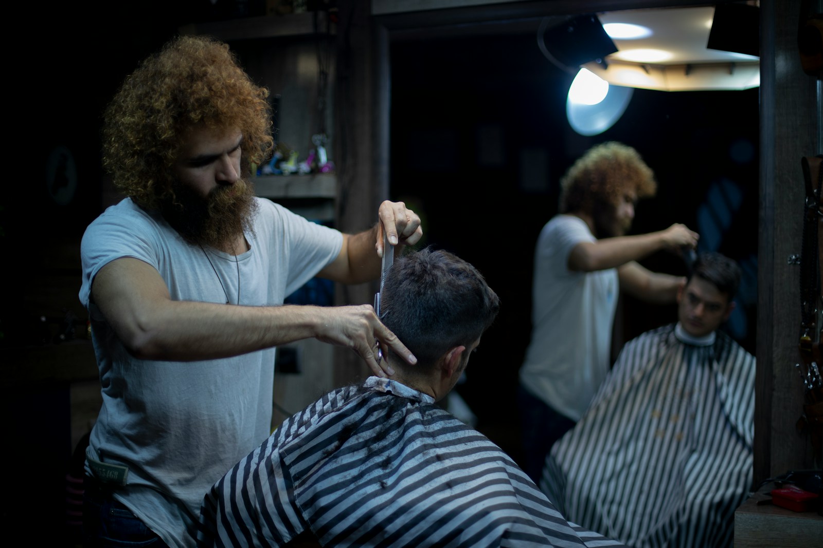 person having hair cut