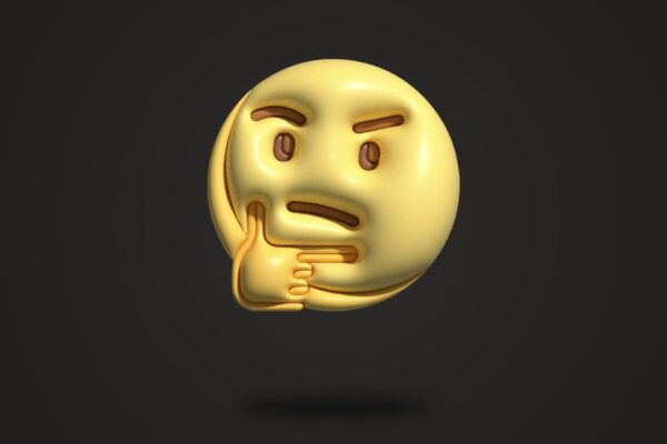 a golden emoticive smiley face on a black background