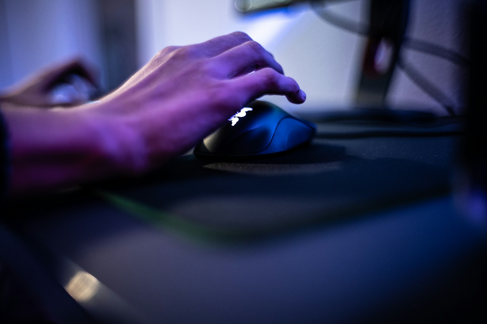a person's hand on a computer mouse